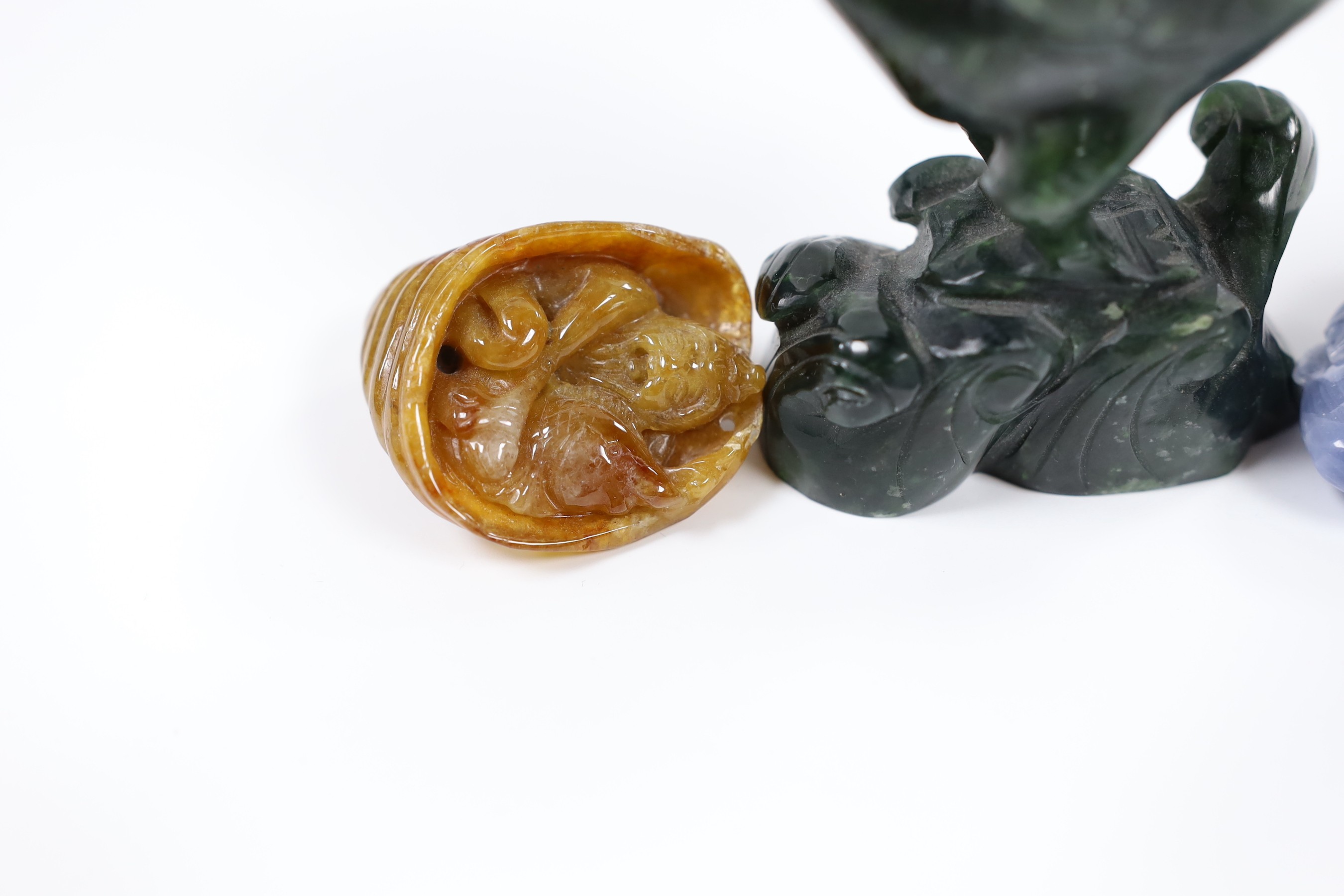 A Nephrite carving of a reading phoenix, 13cm tall, and three other carvings (4)